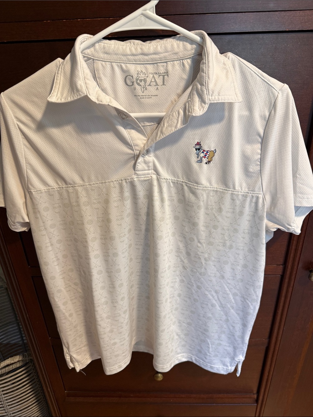 The GOAT Kids' White Golf Polo with Embroidered Goat Logo